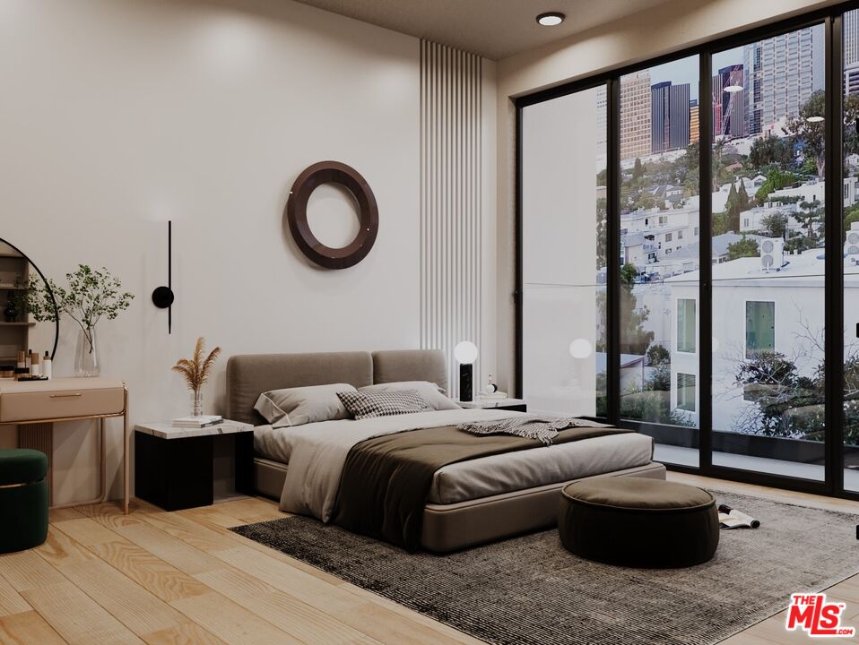 1900 Holmby Avenue Los Angeles, CA 90025 - Photo 7 of 8 a bedroom with a large bed and a large window