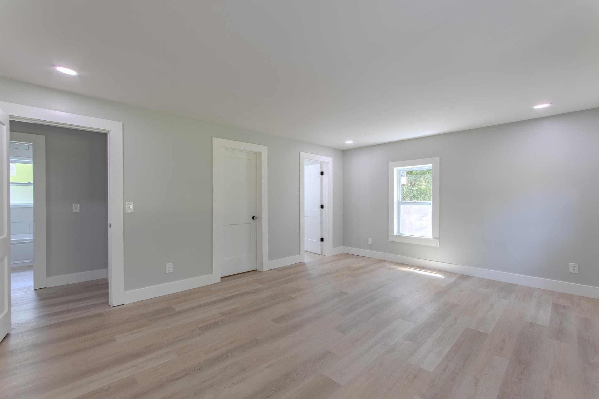 6800 Glendale Road Morris Chapel, TN 38361 - Photo 13 of 36 a view of an empty room with wooden floor and a window