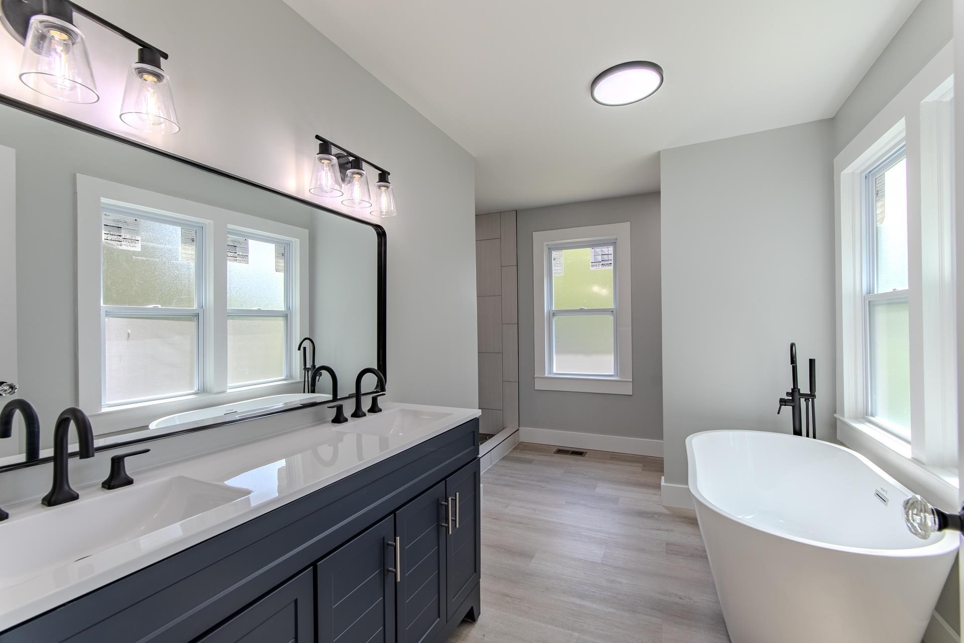 6800 Glendale Road Morris Chapel, TN 38361 - Photo 14 of 36 a bathroom with a double vanity sink and a bathtub