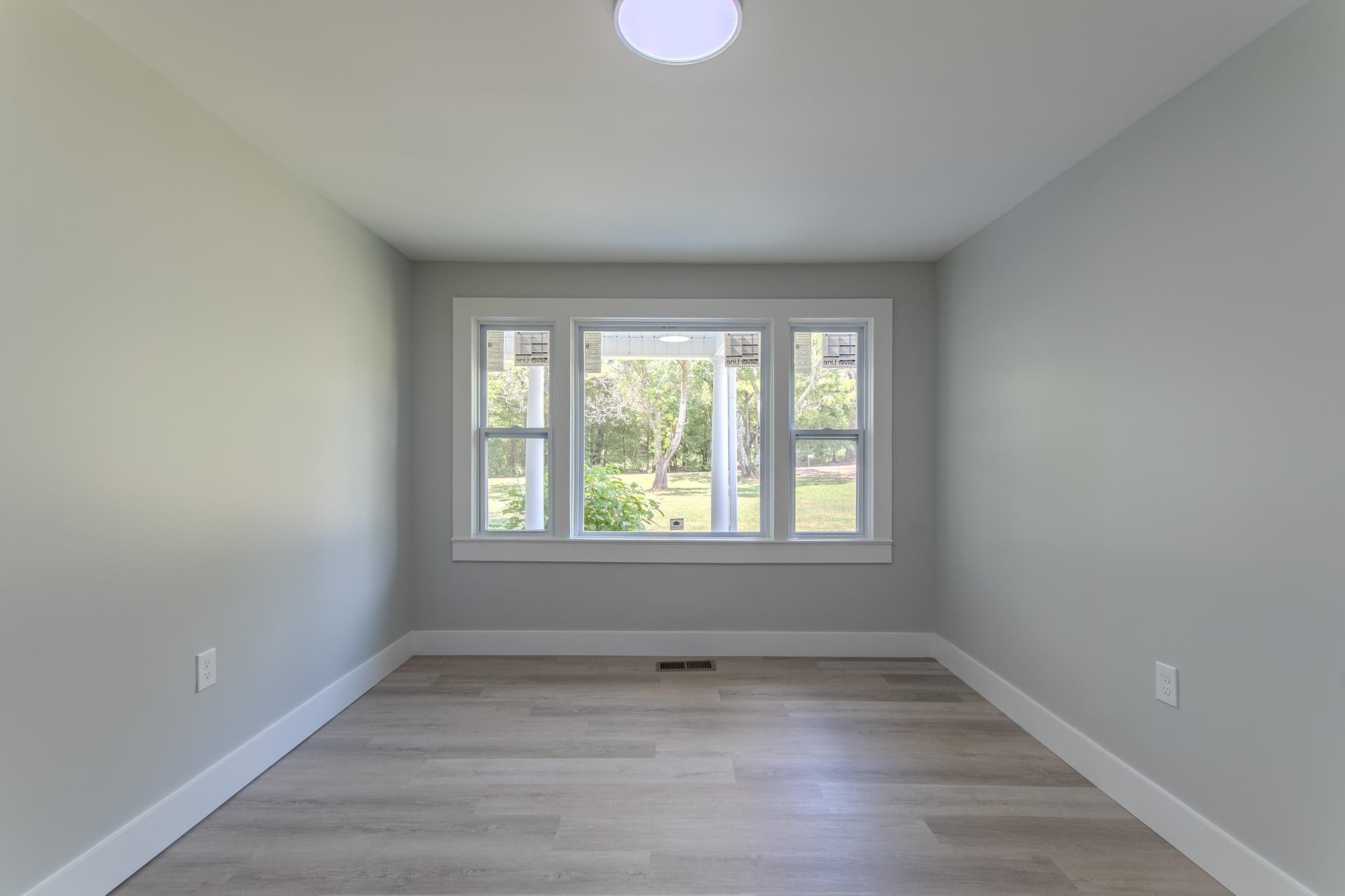 6800 Glendale Road Morris Chapel, TN 38361 - Photo 22 of 36 wooden floor in an empty room with a window