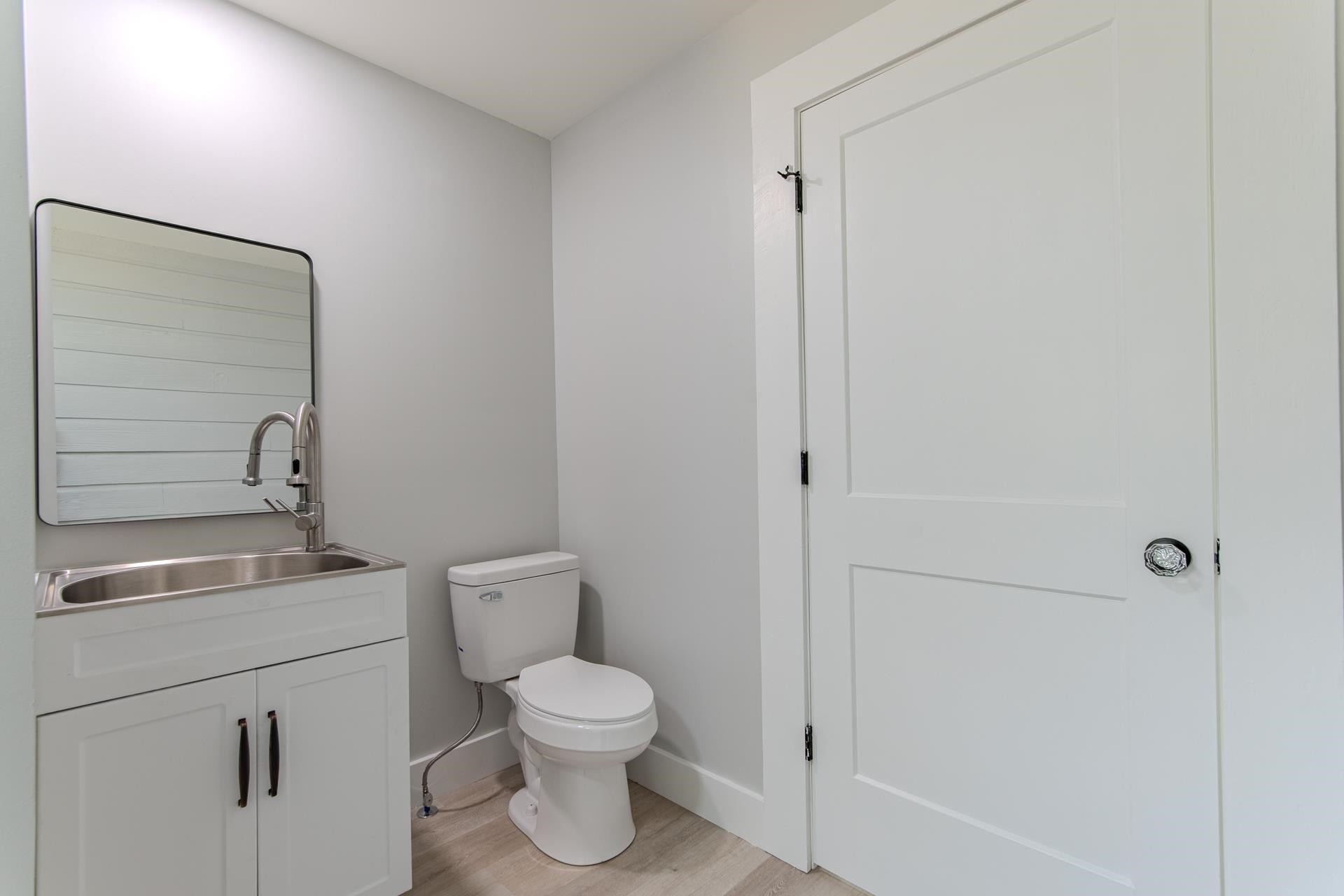 6800 Glendale Road Morris Chapel, TN 38361 - Photo 27 of 36 a white toilet sitting next to a bathroom sink