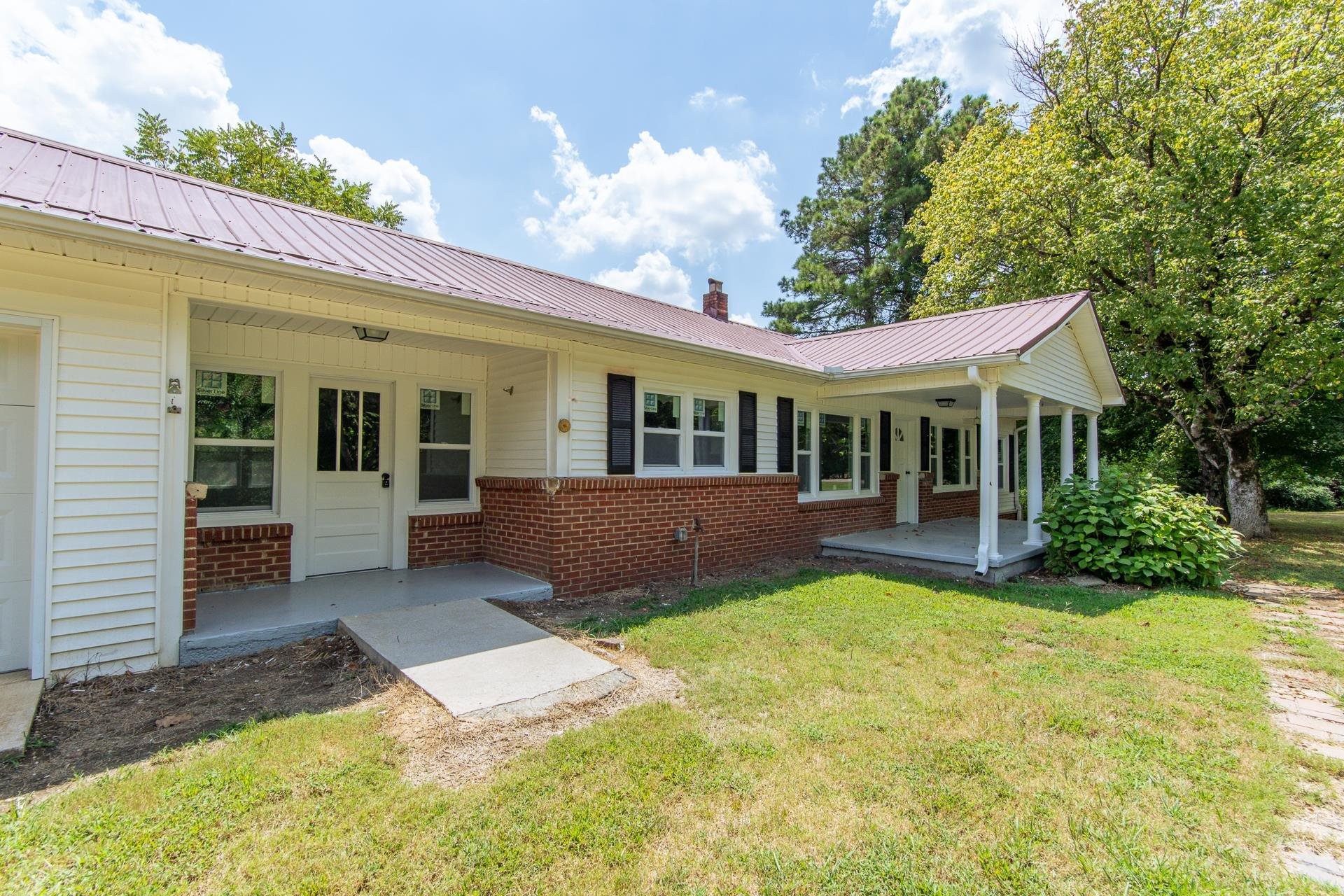 6800 Glendale Road Morris Chapel, TN 38361 - Photo 30 of 36 a view of a house with a yard and porch
