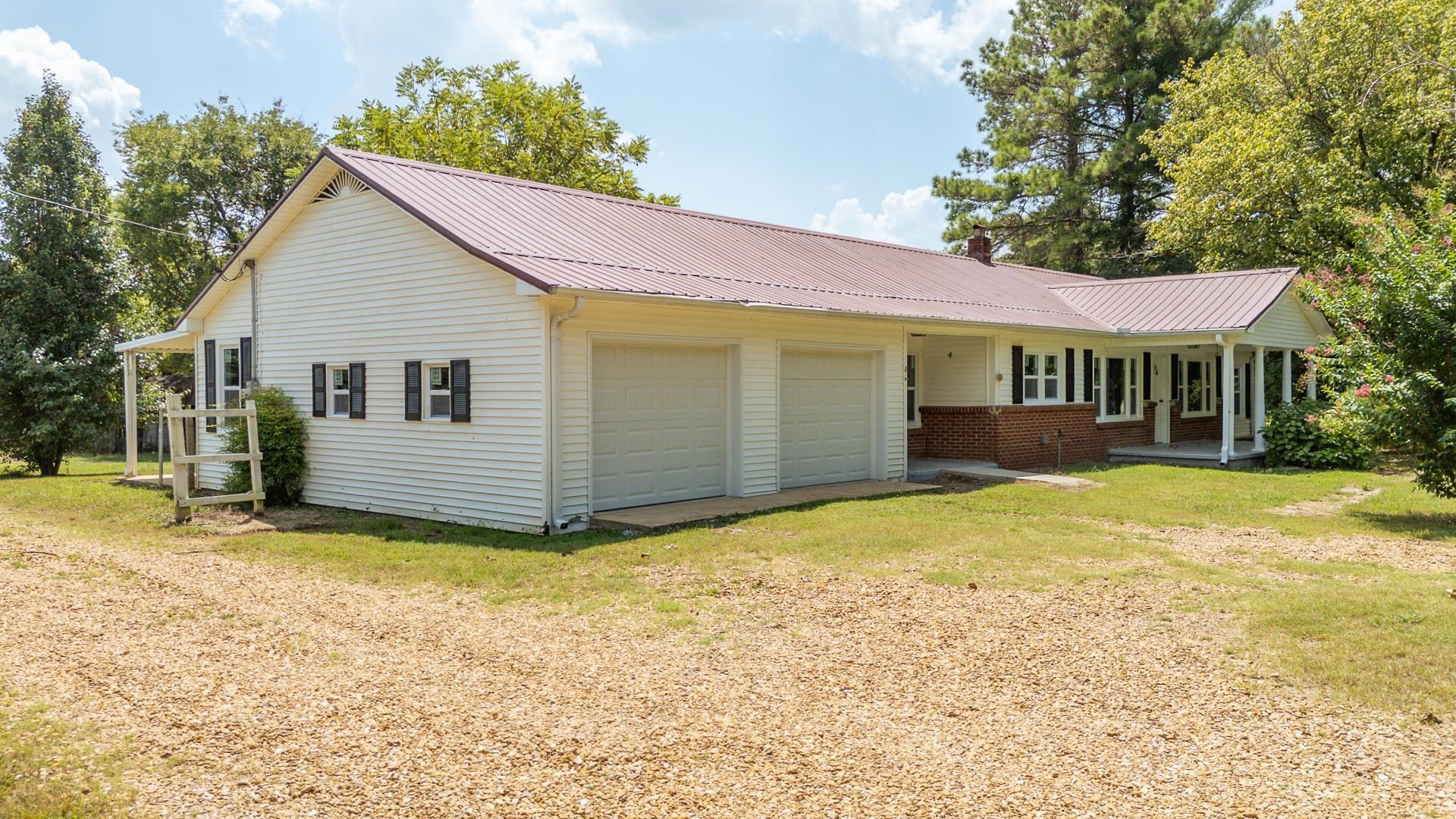 6800 Glendale Road Morris Chapel, TN 38361 - Photo 32 of 36 a view of a house with a yard