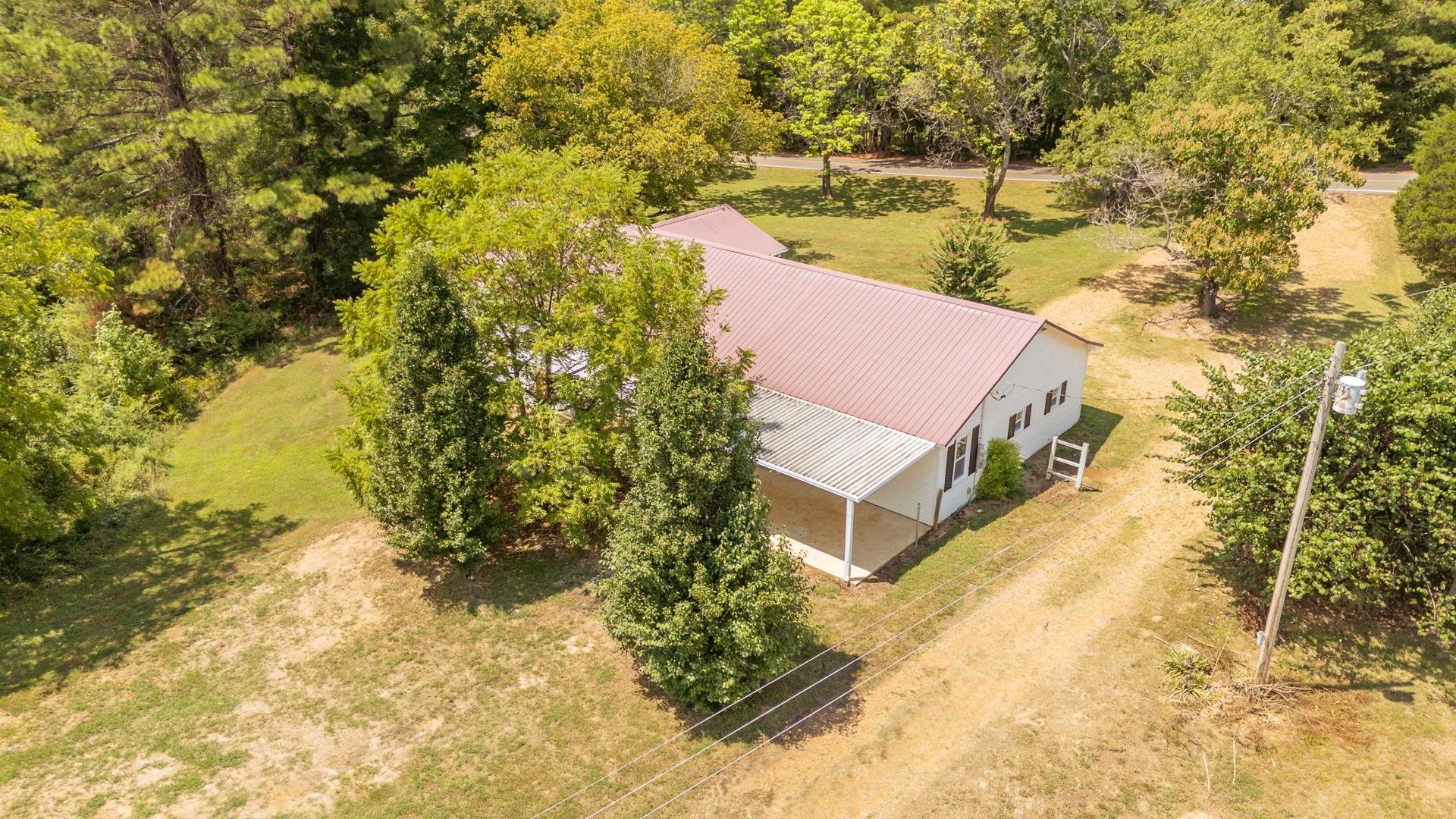 6800 Glendale Road Morris Chapel, TN 38361 - Photo 36 of 36 a aerial view of a house with a yard and lake view
