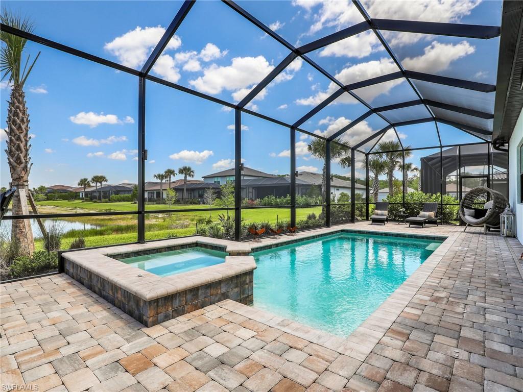 18412 Ridgeline Drive Estero, FL 33928 - Photo 24 of 50 a view of swimming pool with seating area and furniture