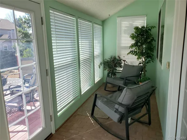 a sitting area with furniture and a potted plant