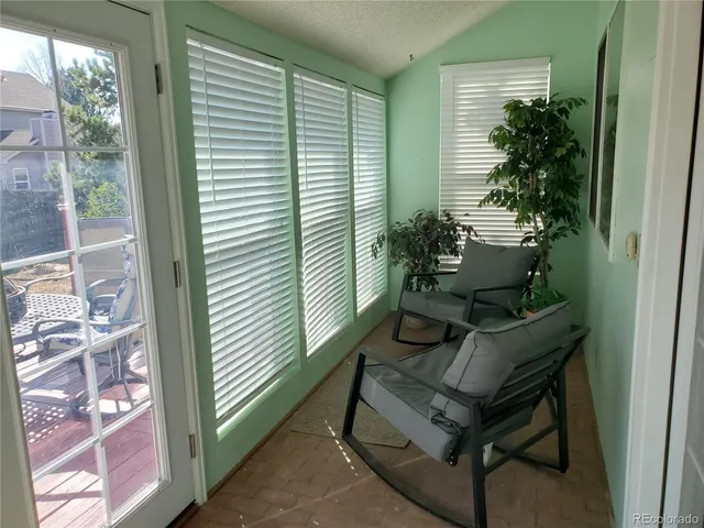 a sitting area with furniture and a potted plant