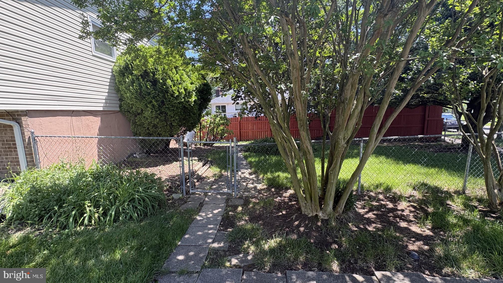 8001 Good Luck Road Lanham, MD 20706 - Photo 10 of 11 Lush garden retreat with fenced privacy.