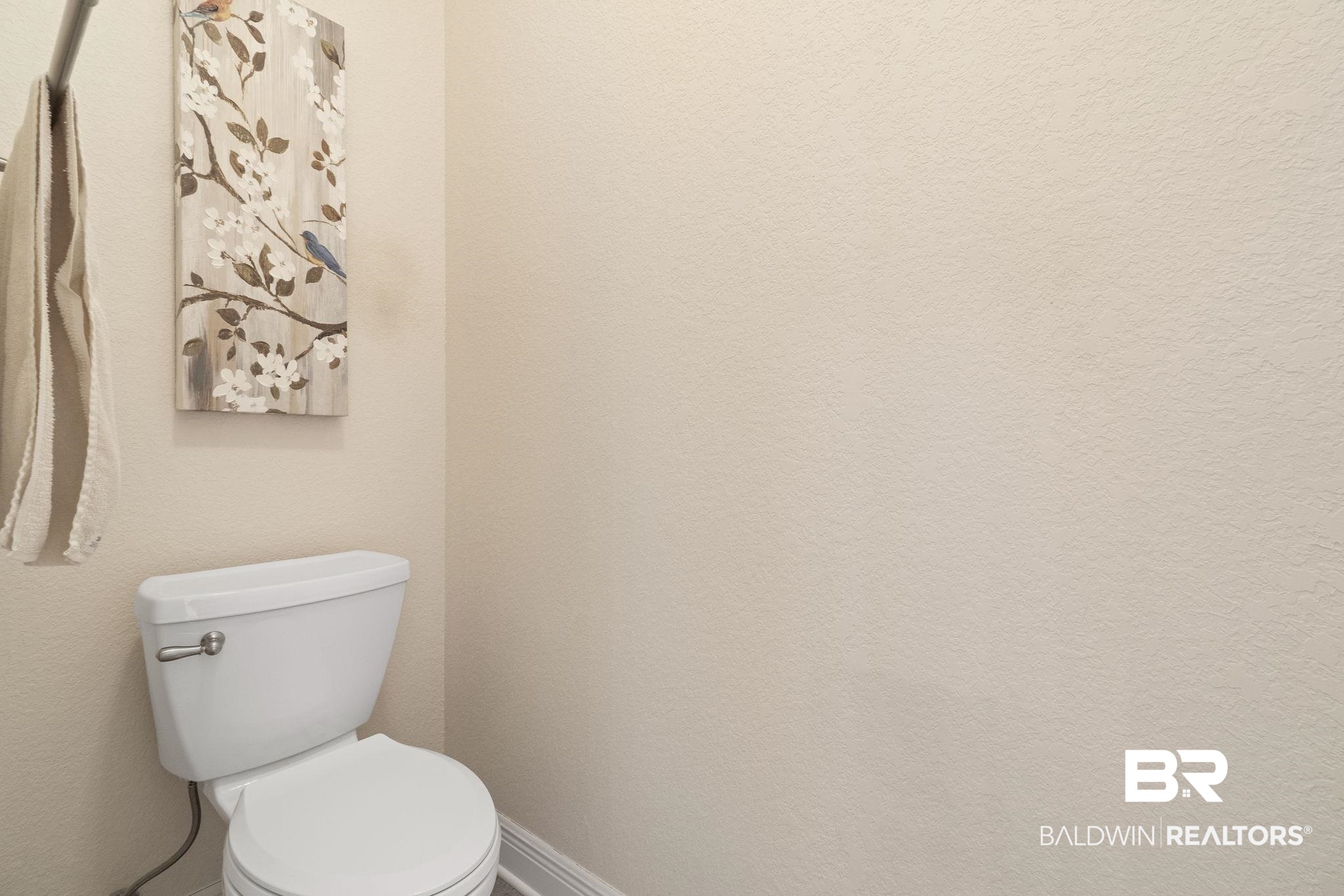 8664 Foxtail Loop Pensacola, FL 32526 - Photo 40 of 64 Bathroom with toilet and baseboards