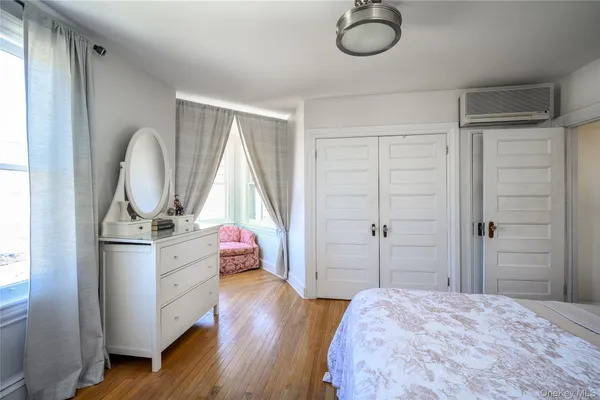 a bed room with a bed and a window