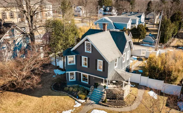 an aerial view of residential houses with outdoor space