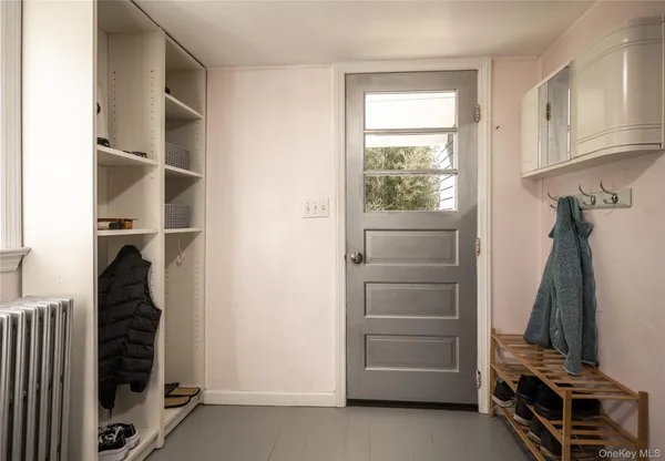 a large bed sitting in a window next to a window