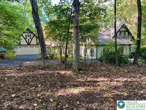 a view of house with trees in the background