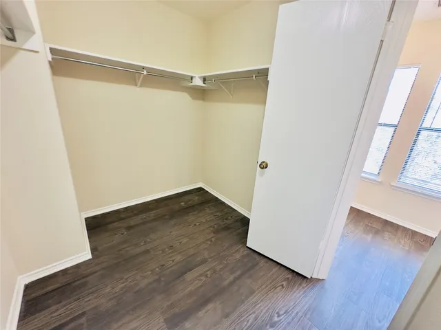 a view of an empty walk in closet