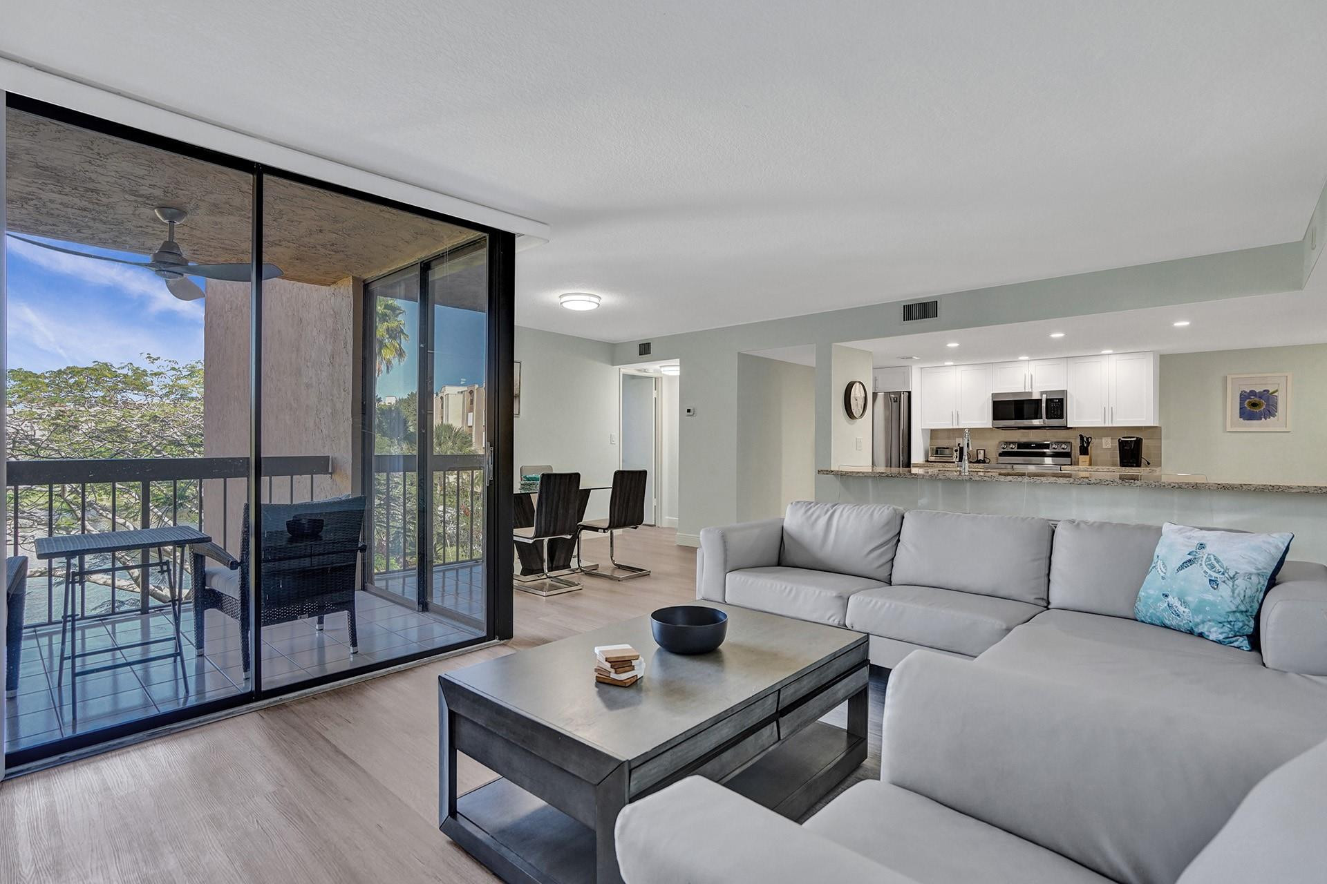 955 Dotterel Road, Unit 2304 Delray Beach, FL 33444 - Photo 1 of 47 a living room with furniture and a large window
