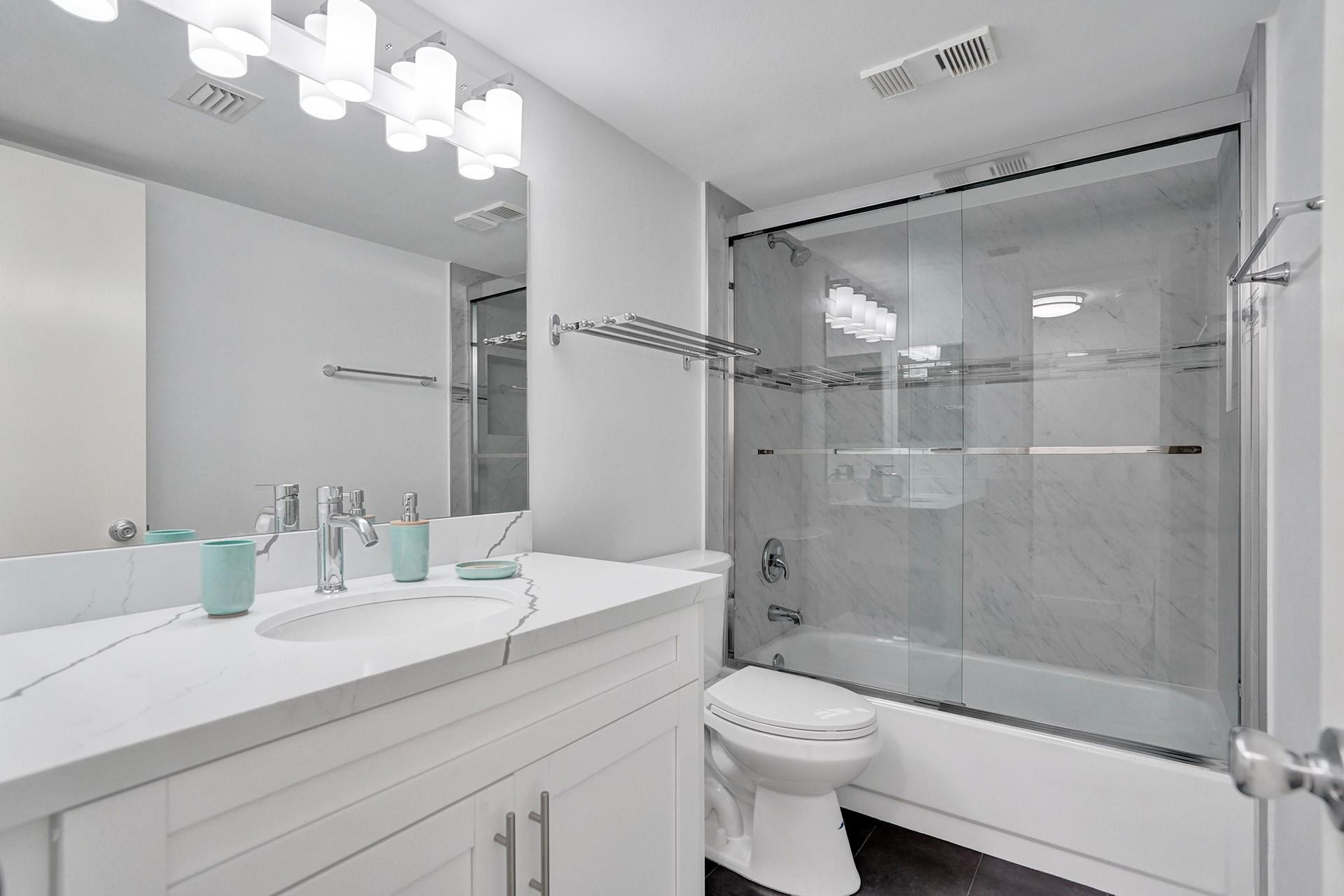 955 Dotterel Road, Unit 2304 Delray Beach, FL 33444 - Photo 11 of 47 a bathroom with a sink a toilet and shower