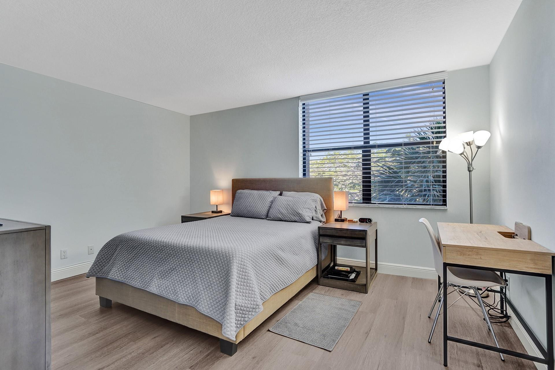 955 Dotterel Road, Unit 2304 Delray Beach, FL 33444 - Photo 12 of 47 a bed sitting in a bedroom next to a window