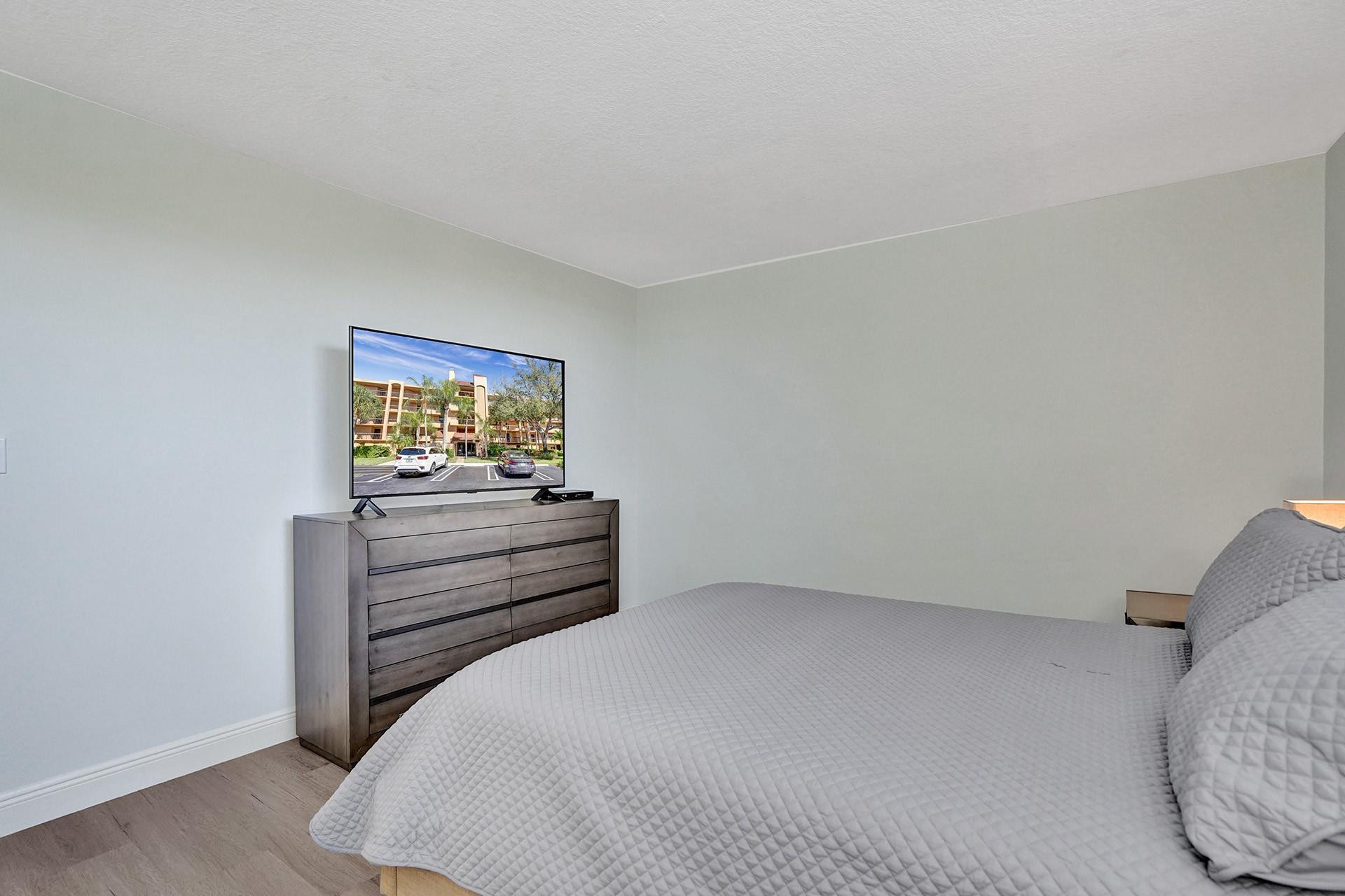 955 Dotterel Road, Unit 2304 Delray Beach, FL 33444 - Photo 14 of 47 a bedroom with a bed and a window