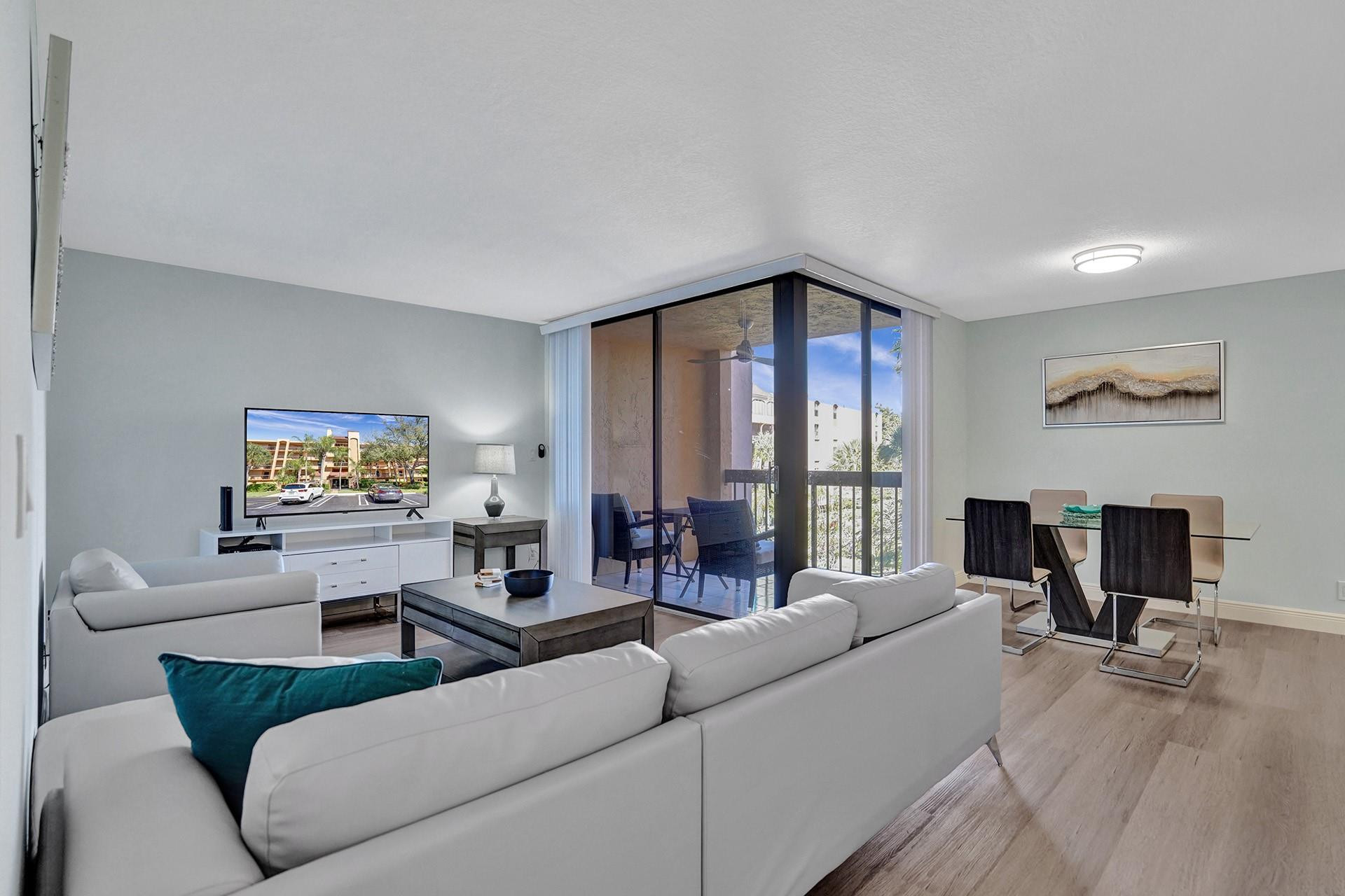 955 Dotterel Road, Unit 2304 Delray Beach, FL 33444 - Photo 22 of 47 a living room with furniture and a flat screen tv