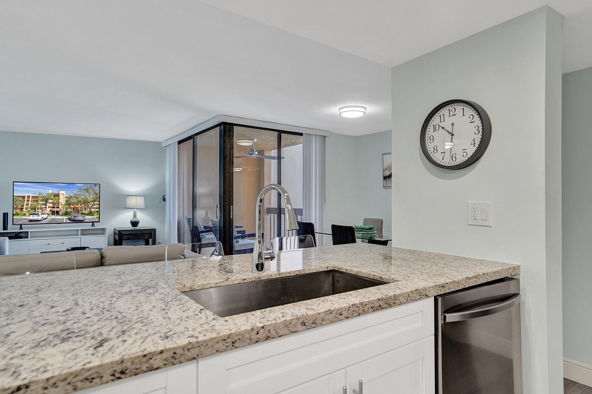 955 Dotterel Road, Unit 2304 Delray Beach, FL 33444 - Photo 33 of 47 a view of a kitchen counter space a sink and wooden floor