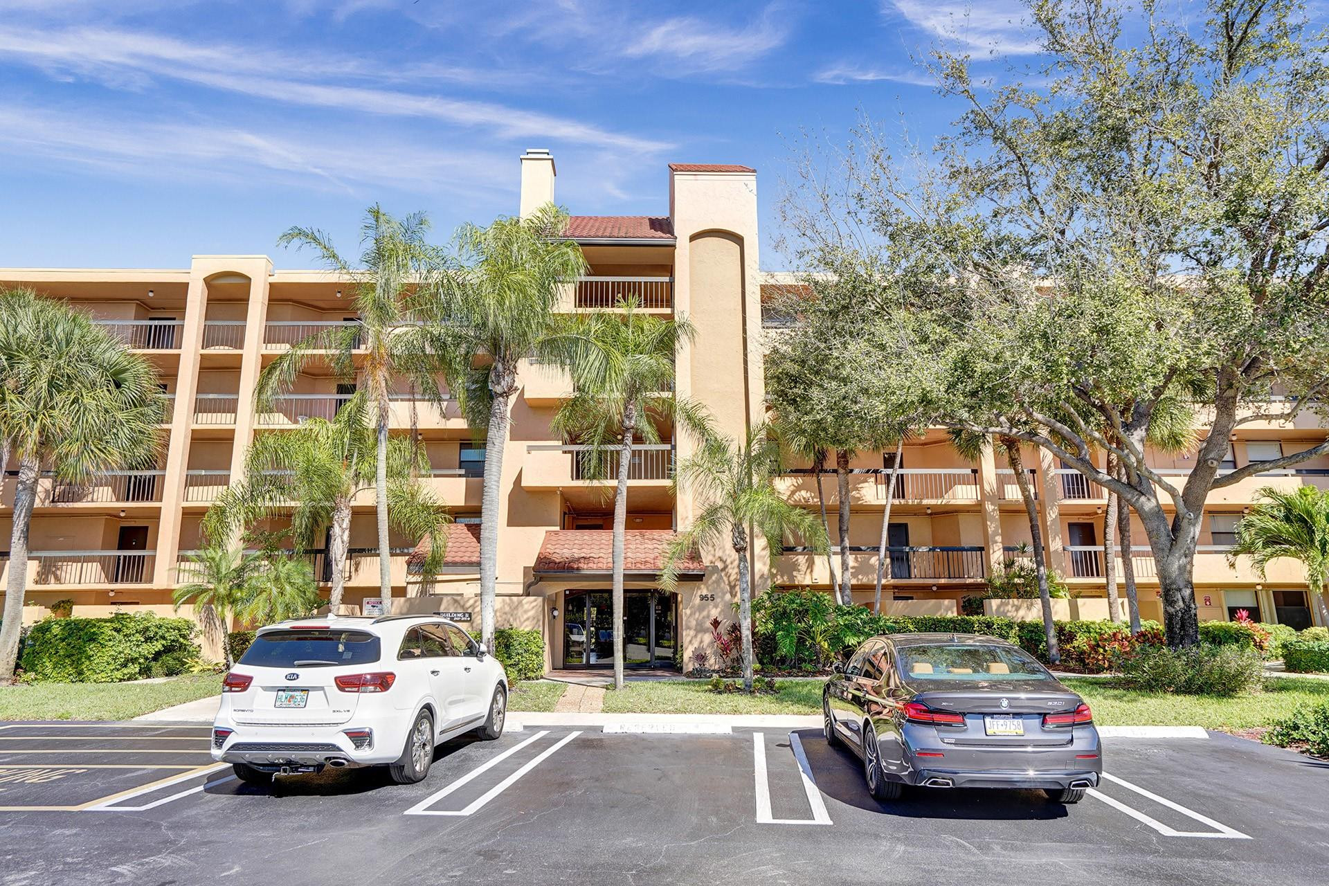 955 Dotterel Road, Unit 2304 Delray Beach, FL 33444 - Photo 45 of 47 a car parked in front of a building