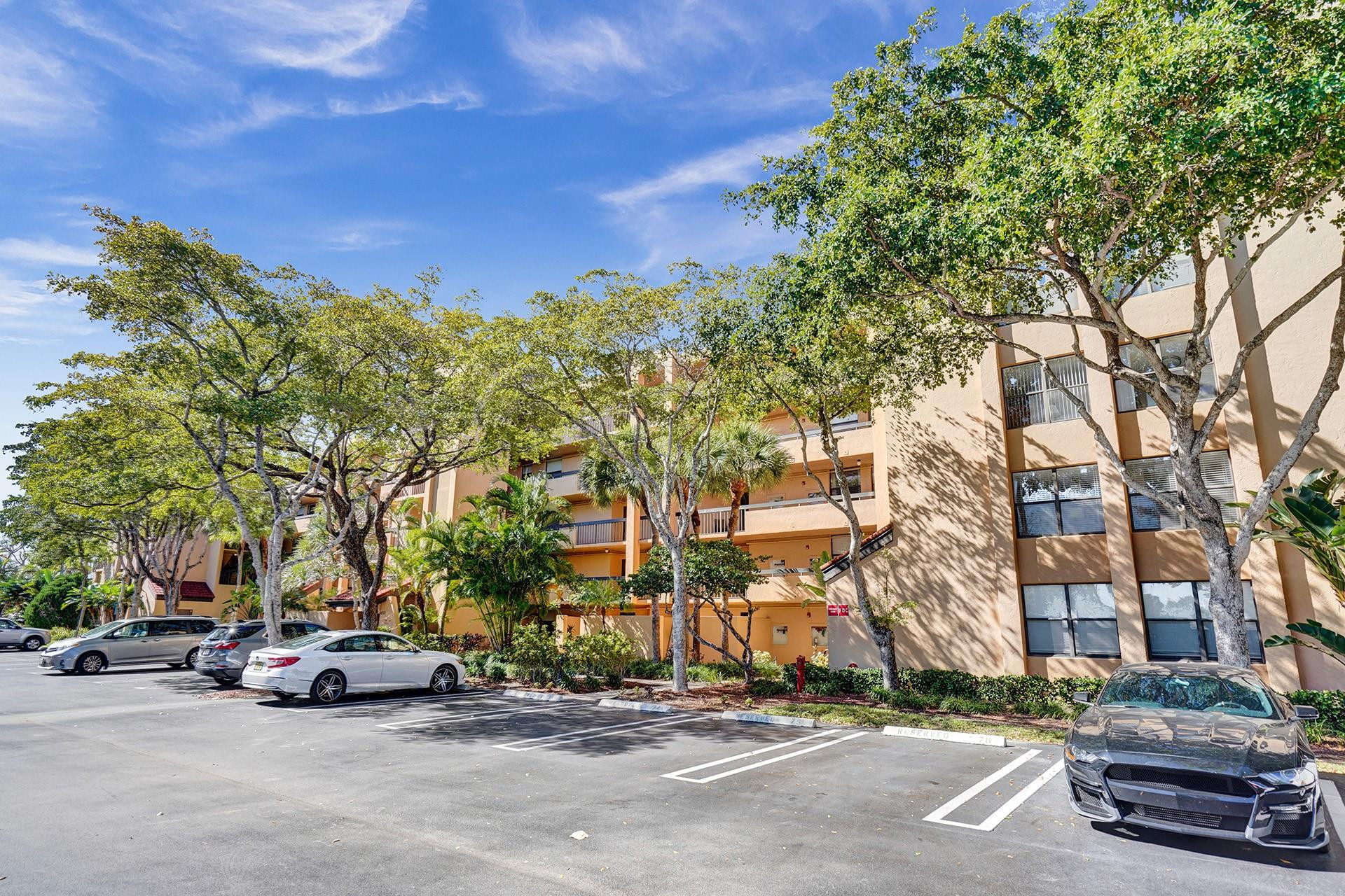 955 Dotterel Road, Unit 2304 Delray Beach, FL 33444 - Photo 46 of 47 a car parked on the side of a street
