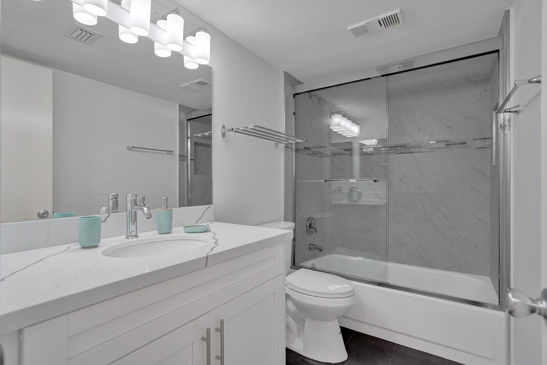 955 Dotterel Road, Unit 2304 Delray Beach, FL 33444 - Photo 10 of 47 a bathroom with a sink a toilet and shower