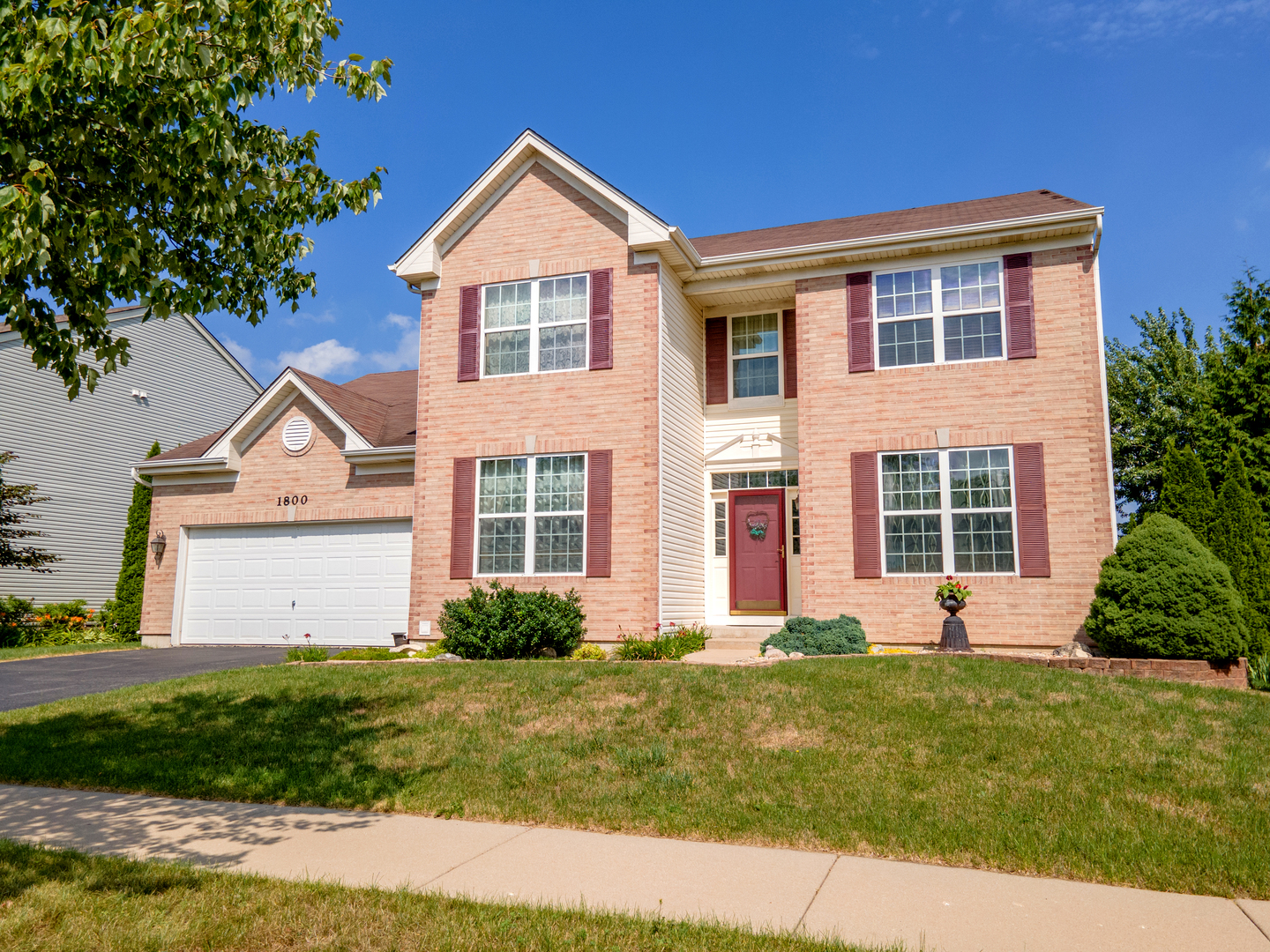 1800 Fulton Lane Sycamore, IL 60178 - Photo 1 of 48 a front view of a house with garden