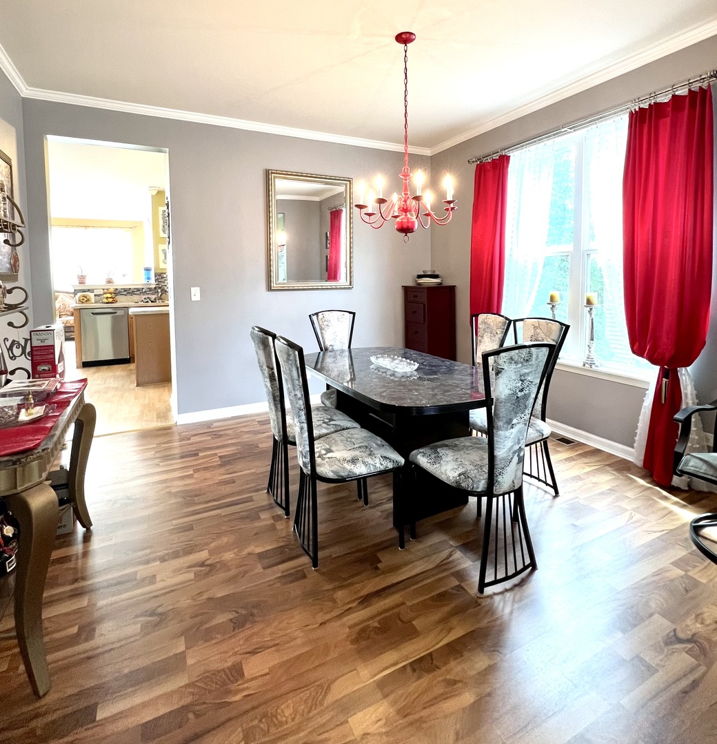 1800 Fulton Lane Sycamore, IL 60178 - Photo 13 of 48 a view of a dining room with furniture window and wooden floor