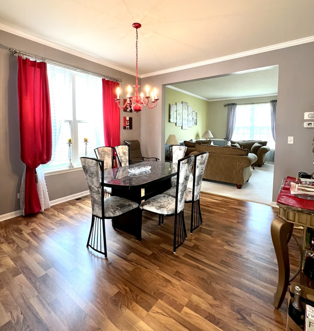 1800 Fulton Lane Sycamore, IL 60178 - Photo 14 of 48 a view of a dining room with furniture window and wooden floor