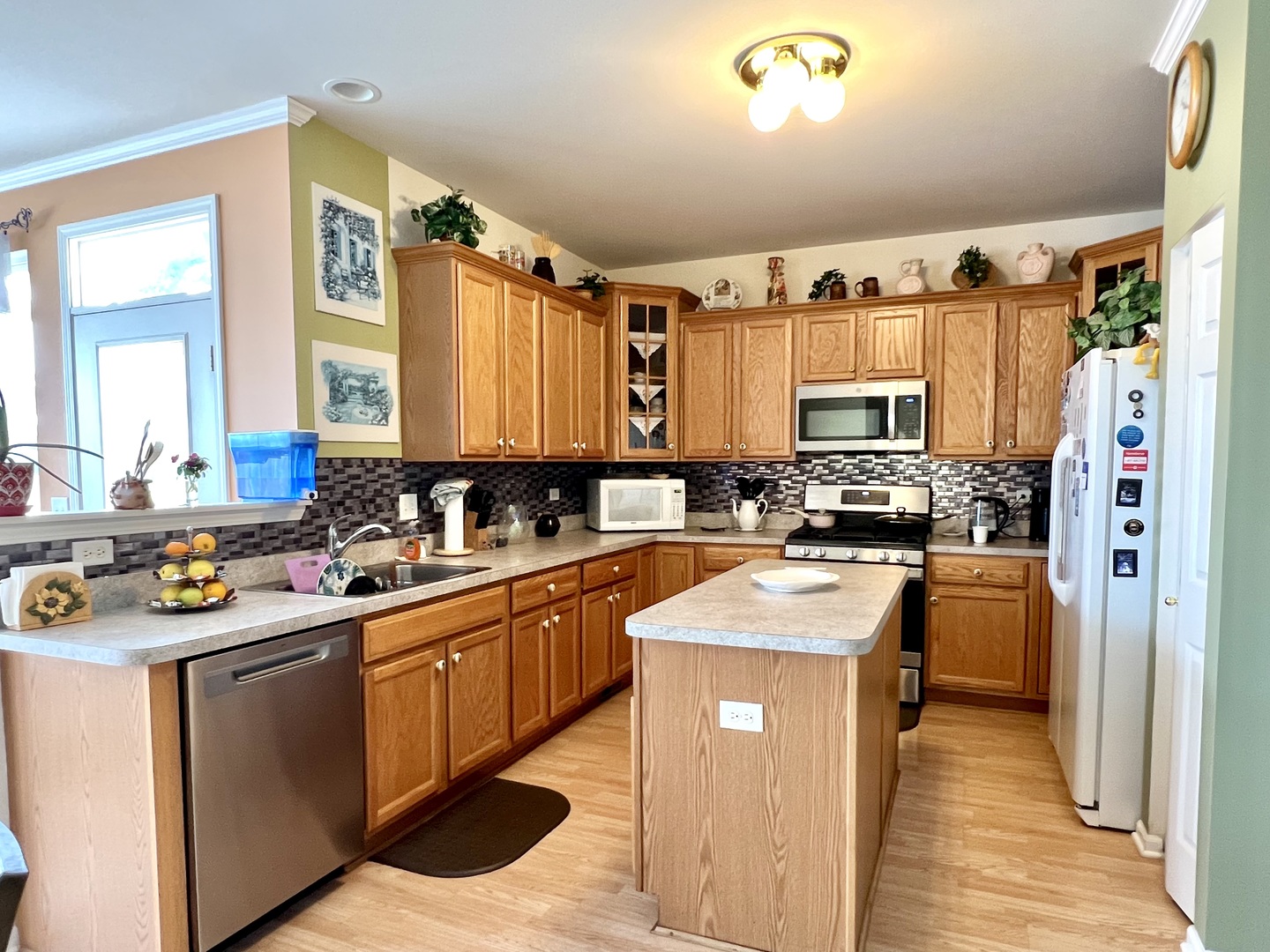 1800 Fulton Lane Sycamore, IL 60178 - Photo 15 of 48 a kitchen with stainless steel appliances granite countertop a sink stove and refrigerator
