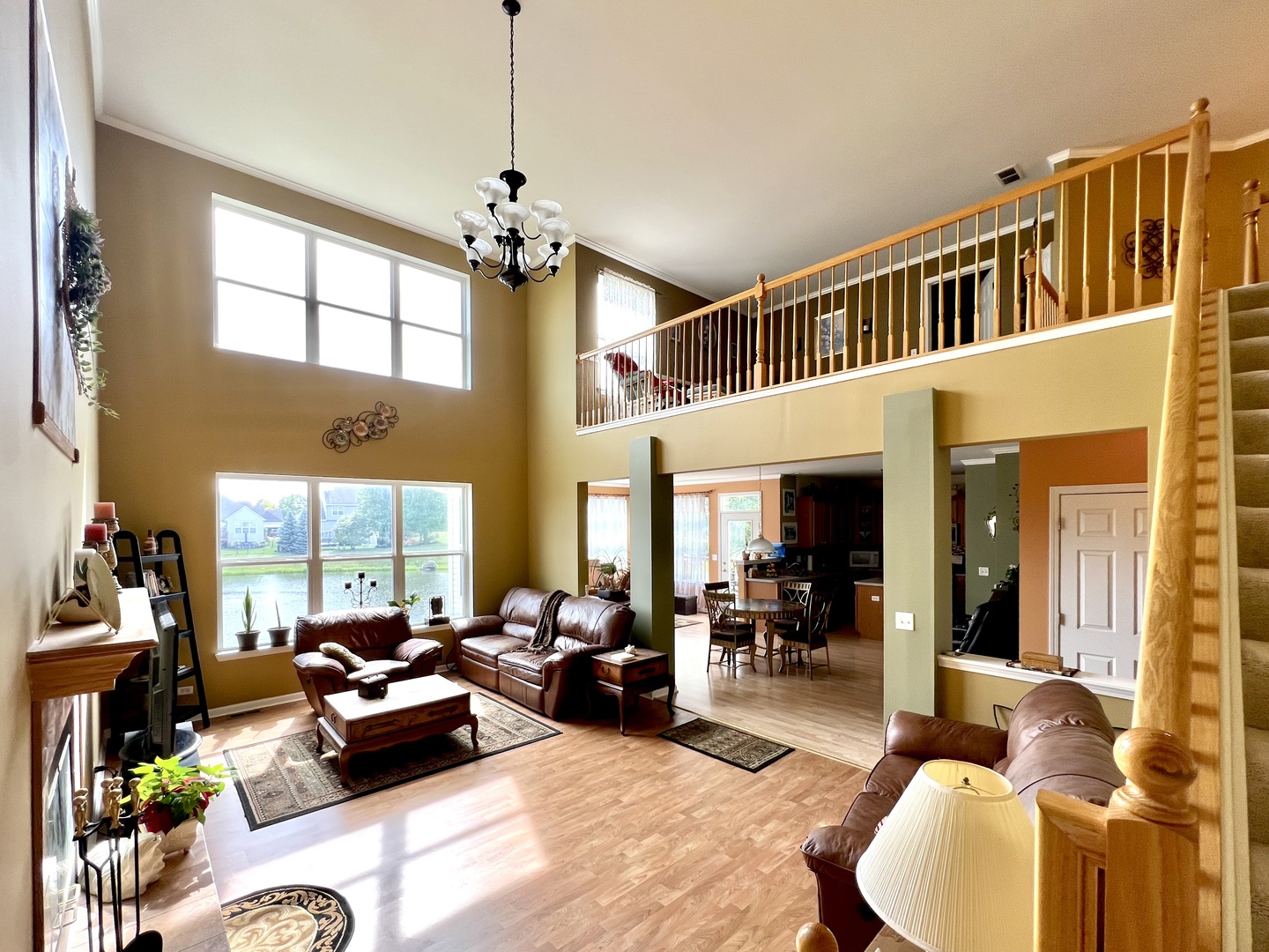 1800 Fulton Lane Sycamore, IL 60178 - Photo 23 of 48 a living room with furniture a chandelier and a large window