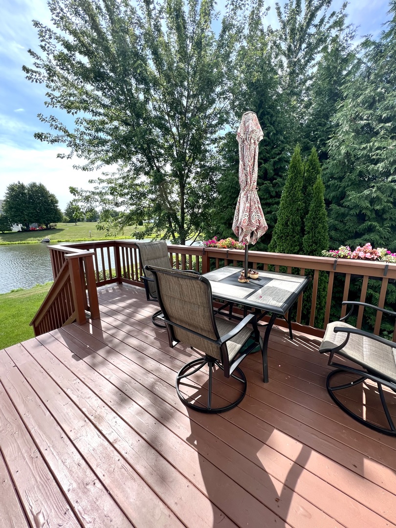 1800 Fulton Lane Sycamore, IL 60178 - Photo 40 of 48 a view of a patio with a table chairs and wooden fence