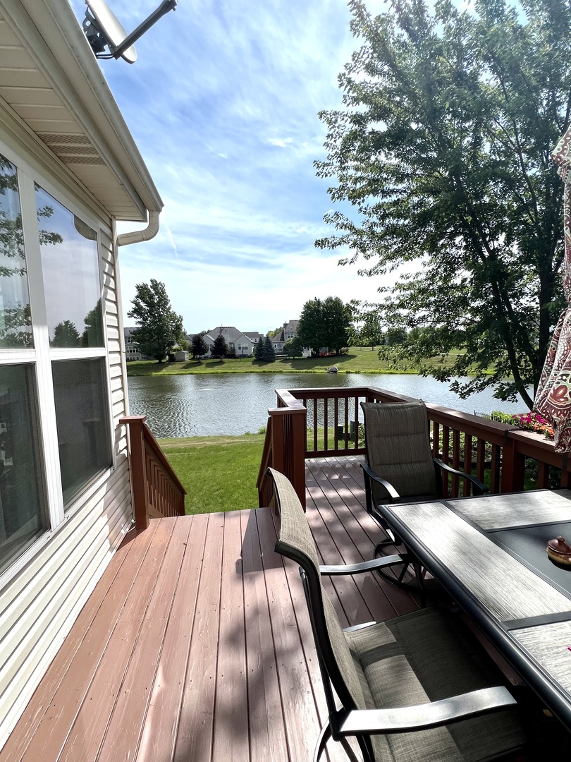 1800 Fulton Lane Sycamore, IL 60178 - Photo 41 of 48 a view of a balcony with wooden floor and outdoor seating
