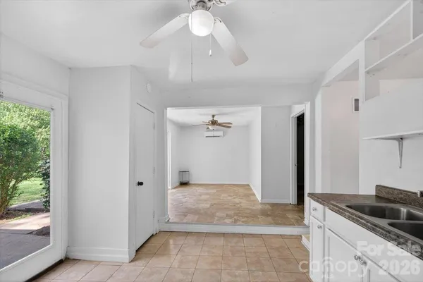 a view of a kitchen with a sink and a window