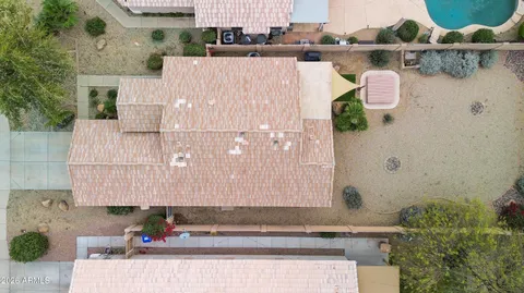 an aerial view of residential house with outdoor space and lake view