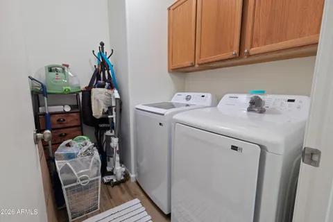a view of storage and utility room with washer and dryer