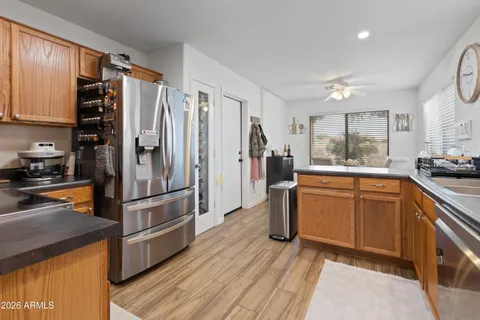 a kitchen with stainless steel appliances a refrigerator sink and cabinets