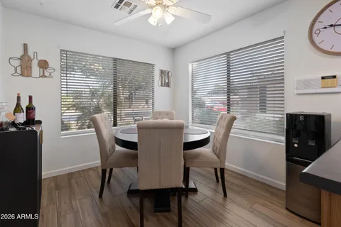 a view of a dining room with furniture window and wooden floor