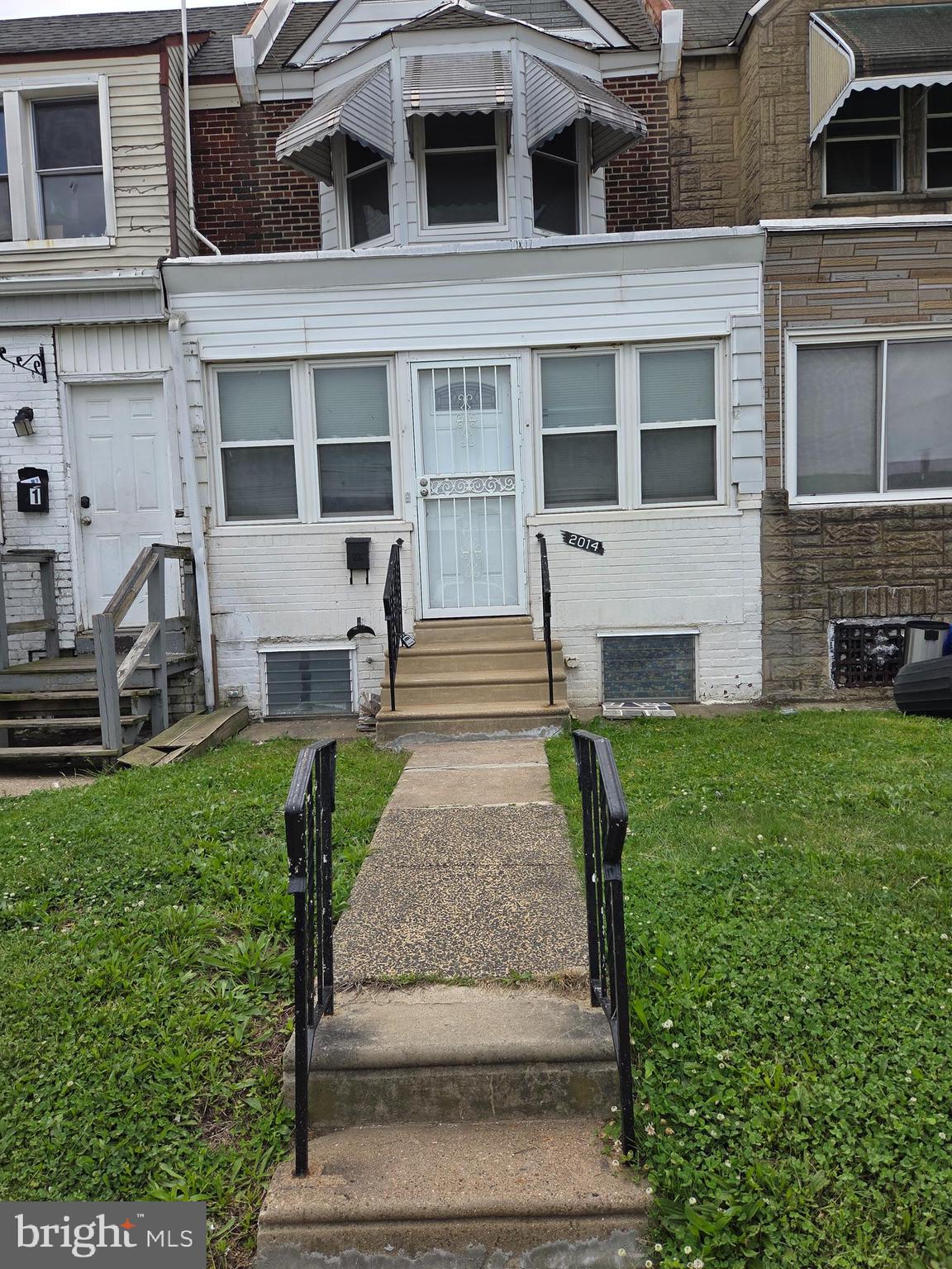 2014 South 68th Street Philadelphia, PA 19142 - Photo 1 of 9 a front view of a house with garden