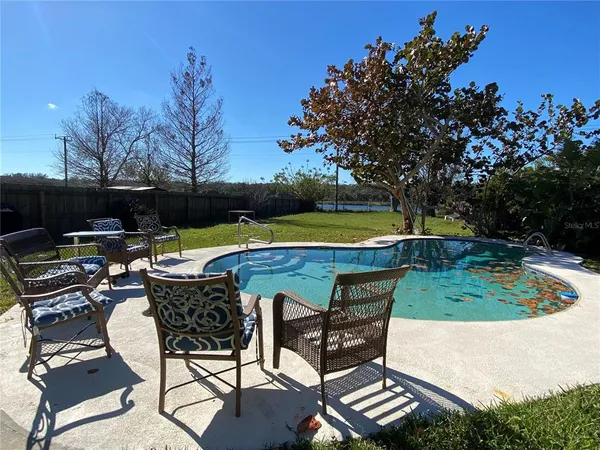 an outdoor space with furniture and garden