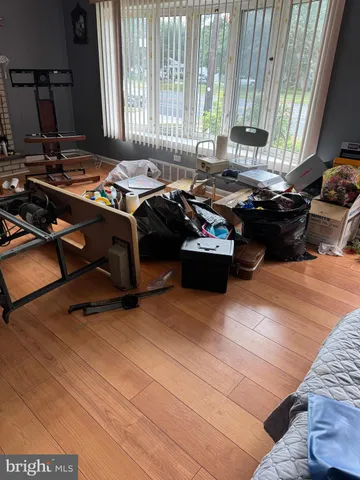 a living room with furniture and a lamp