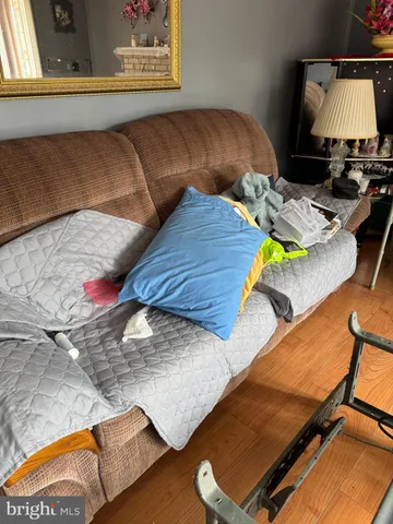 a bedroom with furniture and a fireplace