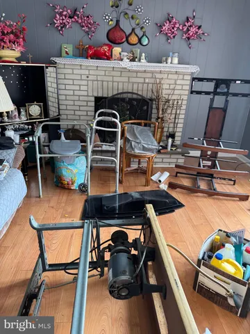 a living room with furniture two window and a table