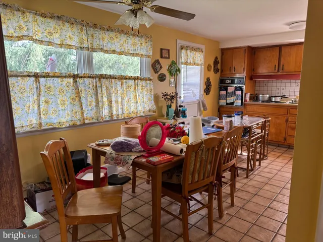 a view of a dining room with furniture window and outside view