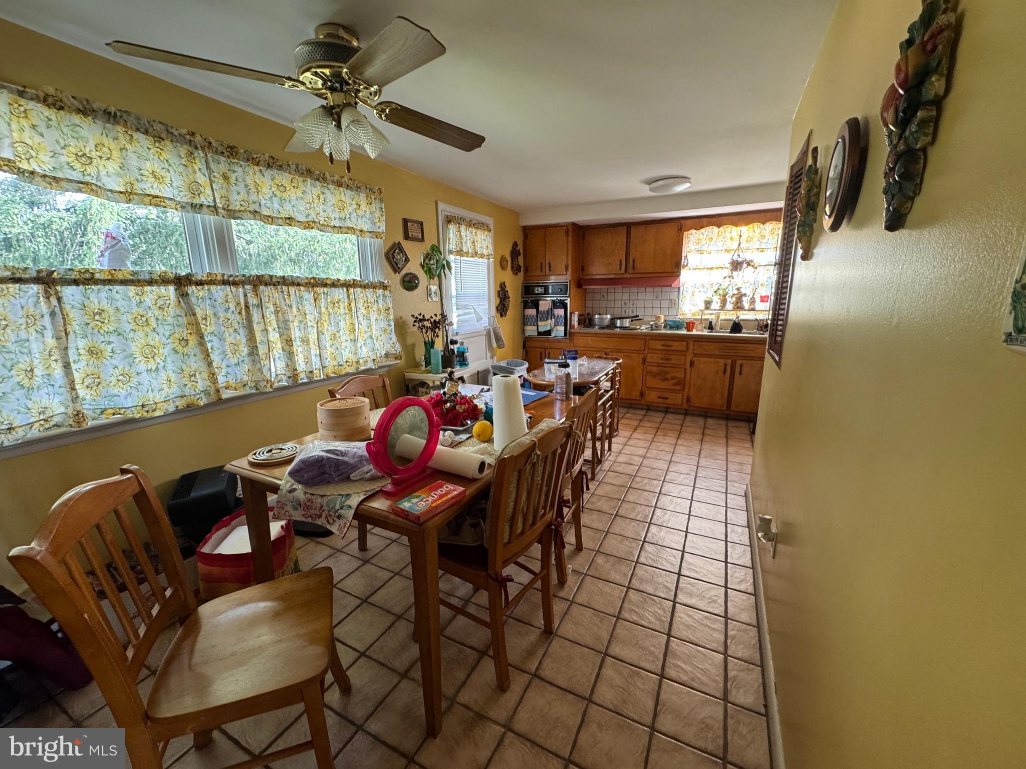 609 Evesham Avenue West Magnolia, NJ 08049 - Photo 22 of 73 a dining room with furniture and a floor to ceiling window