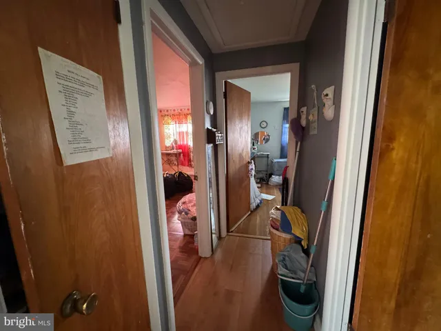 a living room with furniture a window and a lamp