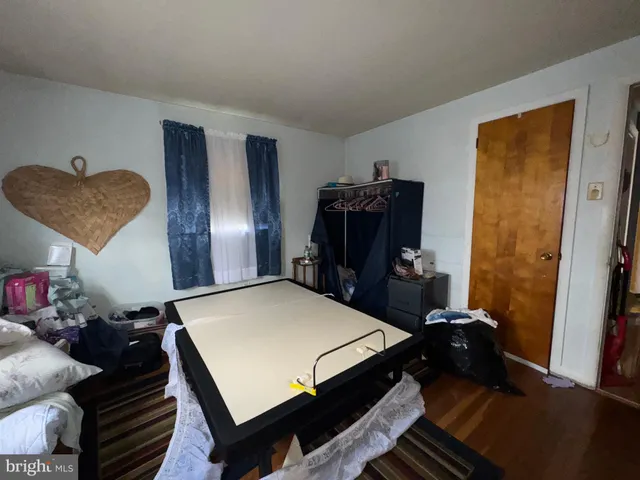 a bathroom with a toilet and a mirror