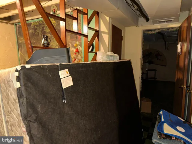 a bed room with furniture and a flat screen tv