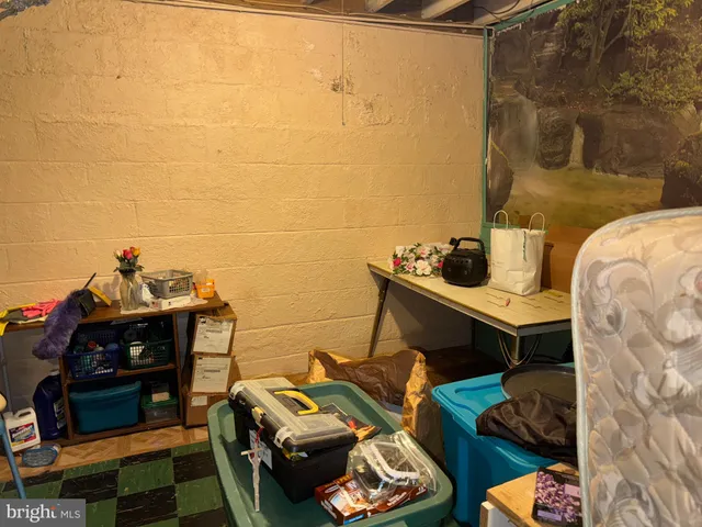 a bed sitting in a room next to a window